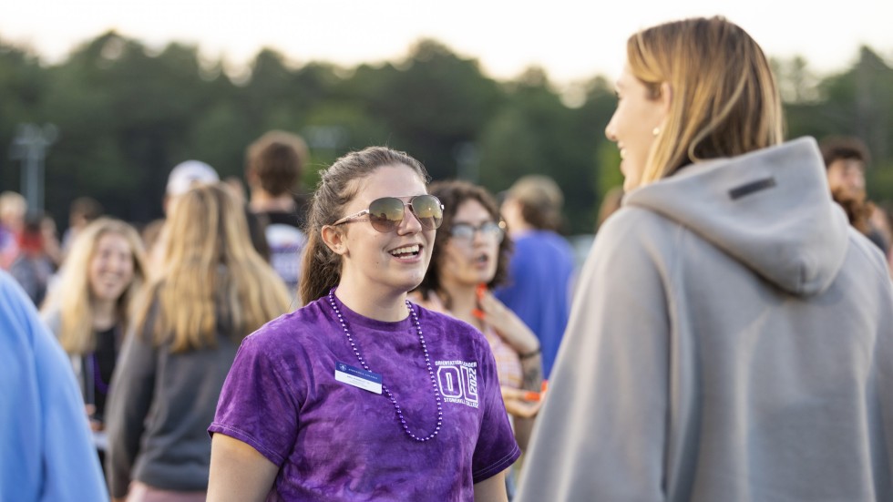 Orientation leader talking to student