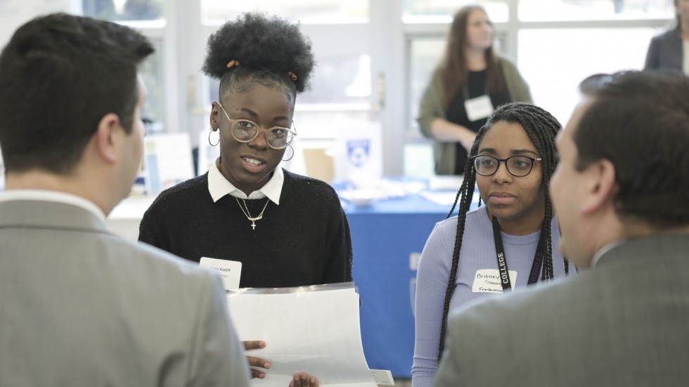 Students talk with employer at Stonehill Career Fair