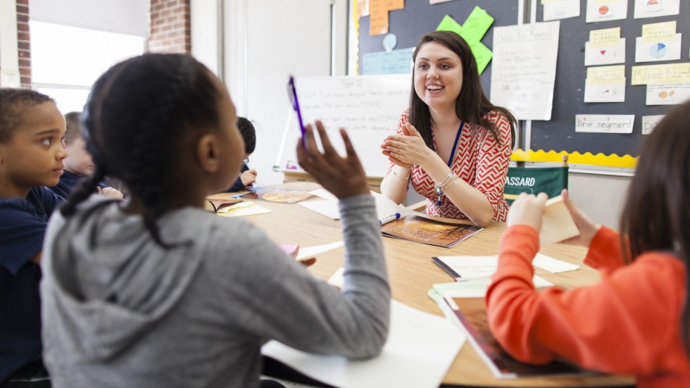 Elizabeth Roy works with students in classroom