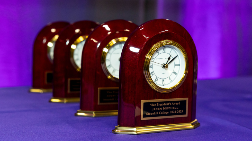 Program from 2025 Student Life Awards set against flowers.