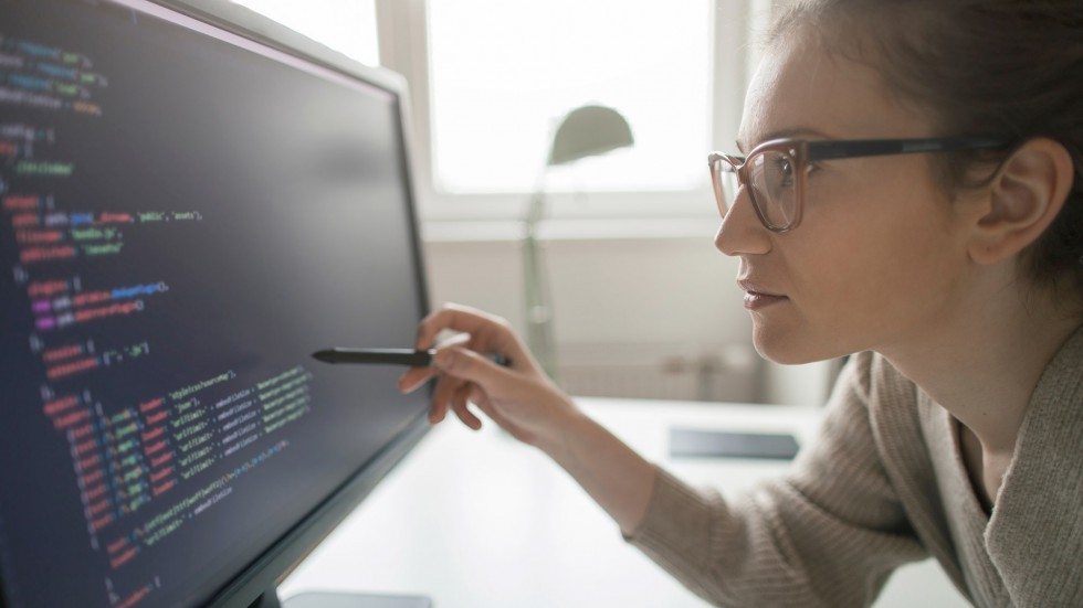 Woman programming on computer