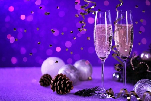 Wine glasses and falling confetti