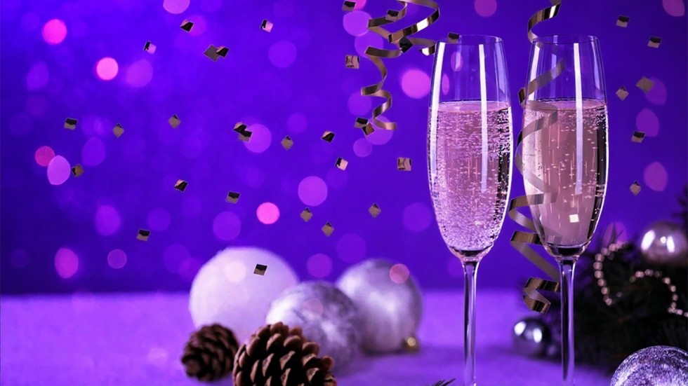 Wine glasses and falling confetti