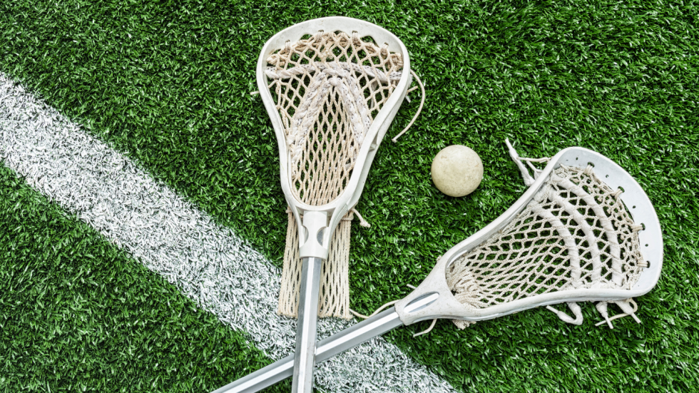 Lacrosse sticks on field