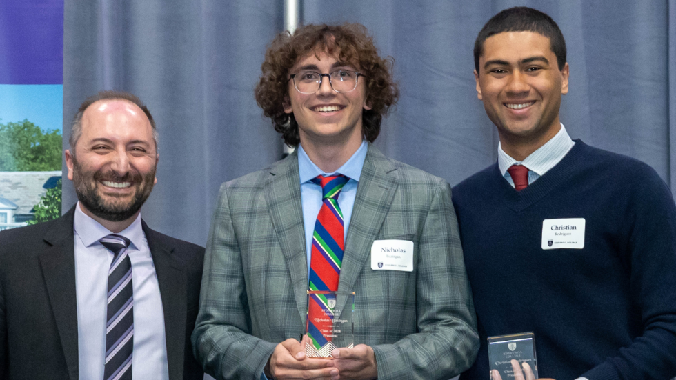 Three people standing side by side.