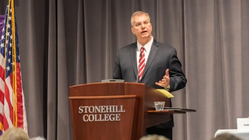 Chief Justice Paul Dawley at podium in Martin Institute.