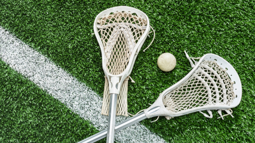 Lacrosse sticks on field
