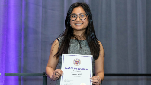 Audrey Sears holding certificate.