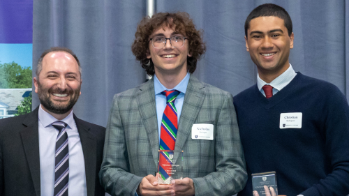 Three people standing side by side.