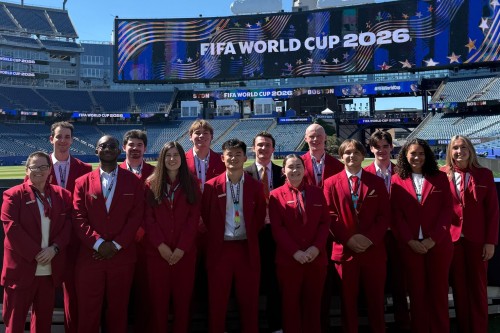 Sport management students pose inside Boston Stadium where they’ve been working in hospitality roles for every match at the FIFA World Cup. 