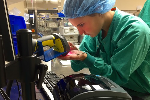 Abby Hersom ’18 scans a newly bar-coded instrument while at her internship at LeeSar