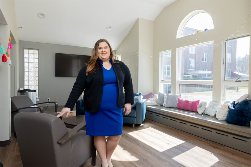 Director of Residence Life Arianna Gulbis in the common room of Quincy, a senior residence hall that was renovated in 2022.