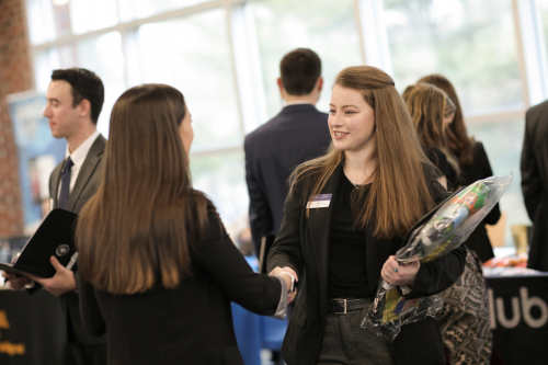 Student meets with employer at a recent Career Fair held at Stonehill College.