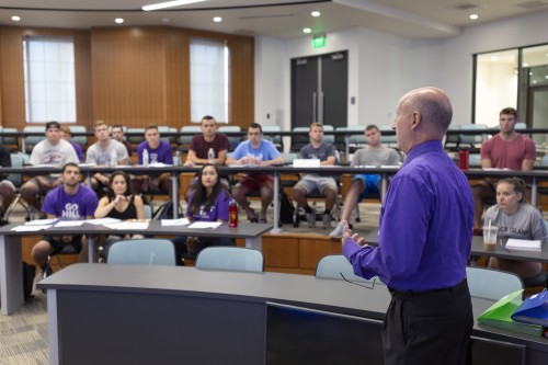 Professor teaching in auditorium in Meehan Hall