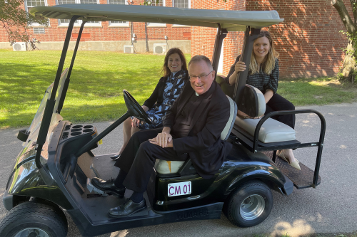 President John Denning, C.S.C., takes Board of Trustees members Judith Salerno '73 (front passenger's seat) and Meaghan Eichmann ’05 (backseat) on a tour of campus.