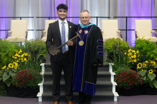 Senior Class President Guilherme Vaz ’25 (left) and President John Denning, C.S.C. (right)