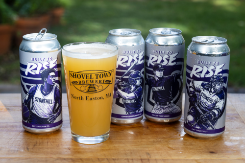 Built to Rise beer cans and beer glass with Shovel Town logo on it.
