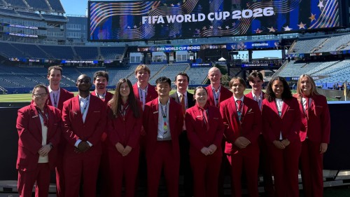 Sport management students pose inside Boston Stadium where they’ve been working in hospitality roles for every match at the FIFA World Cup. 