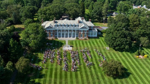 Donahue Hall with students on the hill
