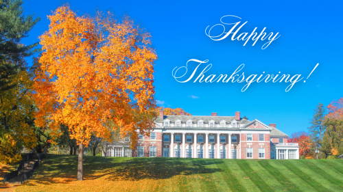 Image of Donahue Hall in the fall, with text above building the reads, "Happy Thanksgiving."