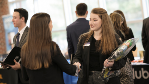 Student meets with employer at a recent Career Fair held at Stonehill College.