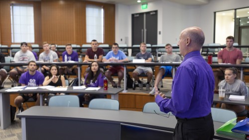 Professor teaching in auditorium in Meehan Hall