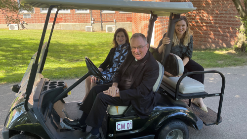 President John Denning, C.S.C., takes Board of Trustees members Judith Salerno '73 (front passenger's seat) and Meaghan Eichmann ’05 (backseat) on a tour of campus.