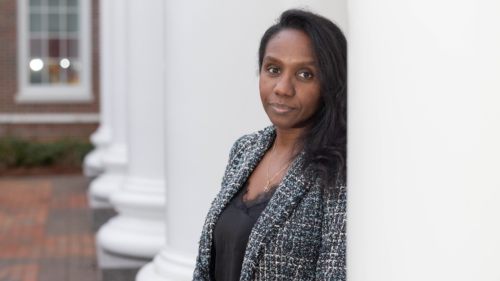 Marie Solange Lopes outside Meehan Hall, leaning against pillar.