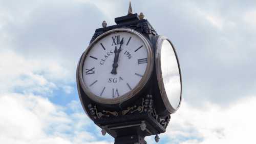 Clock on the quad during daytime.
