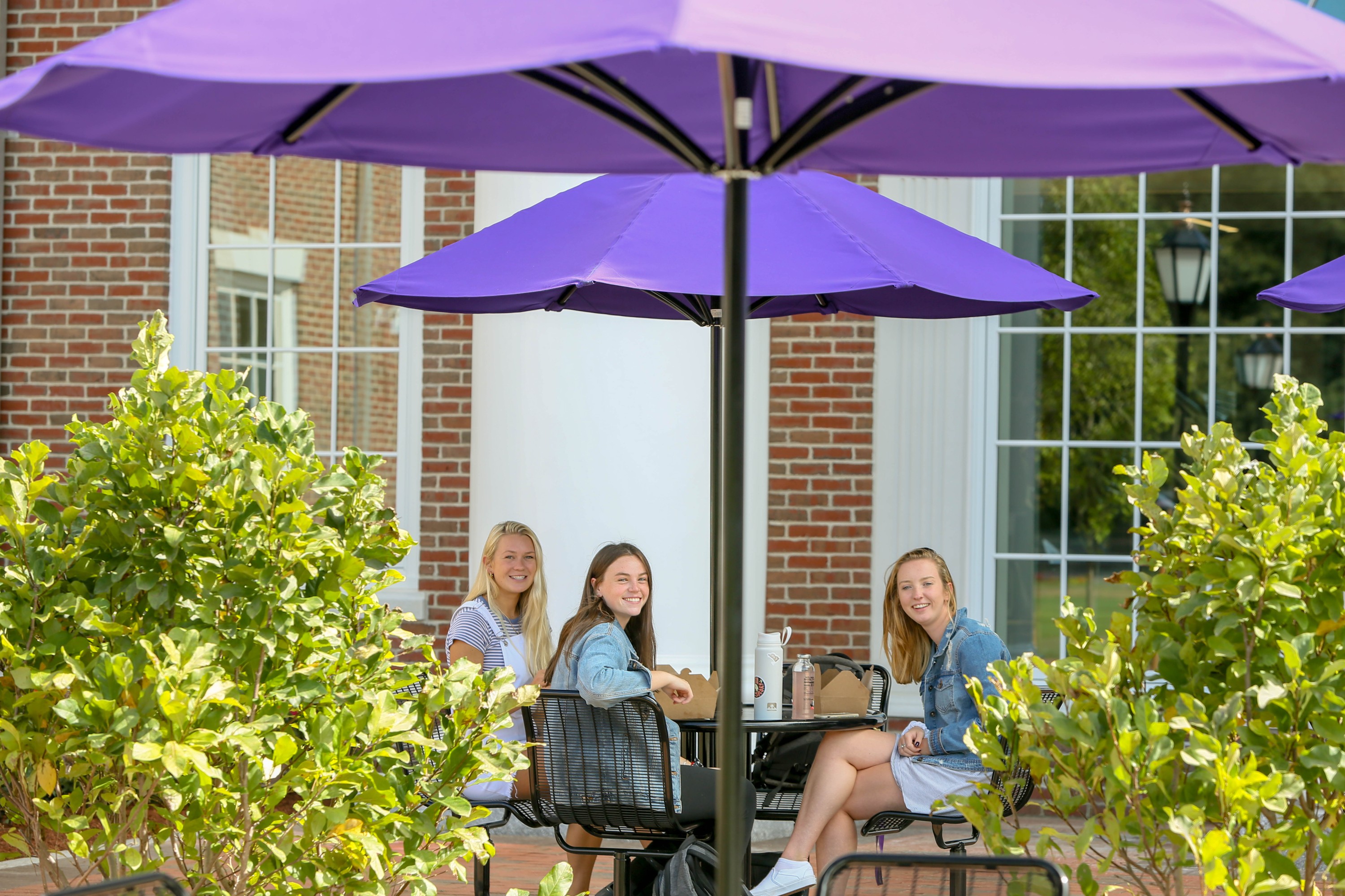 three students at a table