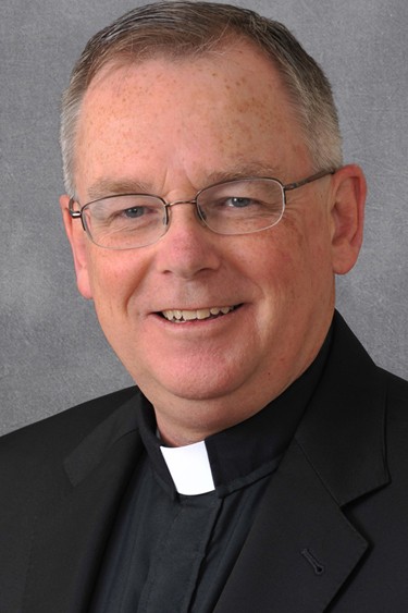 Headshot of Fr. John Denning, C.S.C.